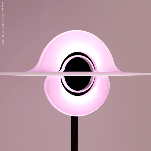 A Black Hole shaped floor lamp with a wooden sculptural stand, emitting soft pink light. Wood stand features a stretched spacetime fabric pattern. 