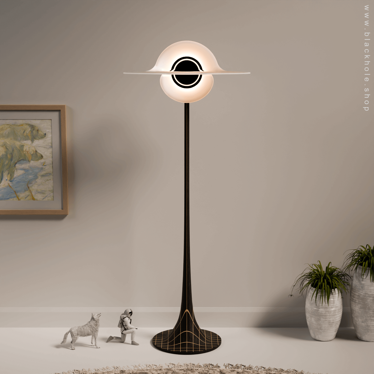 A Black Hole shaped floor lamp with a wooden sculptural stand, emitting warm white light. Wood stand features a stretched spacetime fabric pattern. 