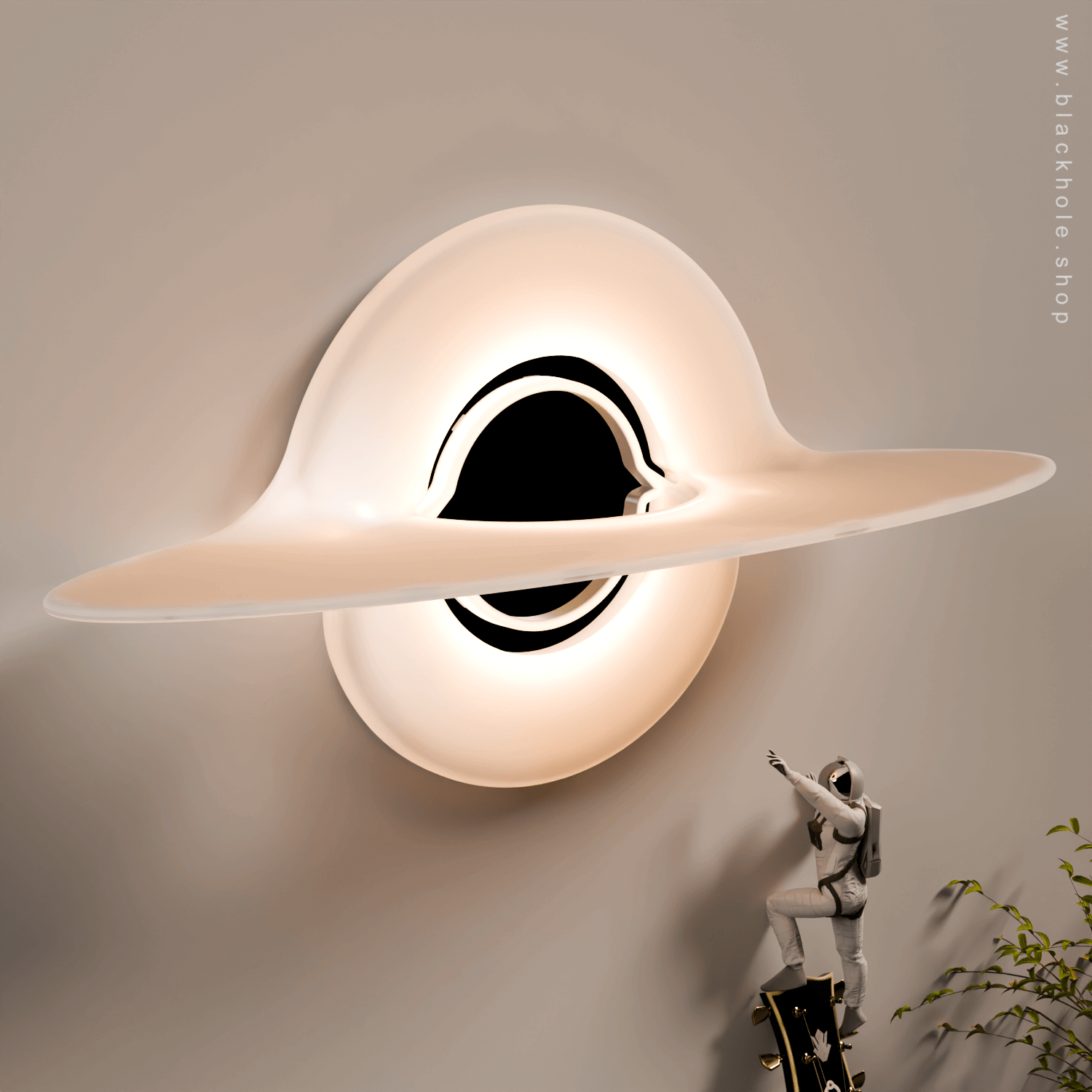 A Black Hole shaped wall lamp mounted on a wall & emitting warm white light.